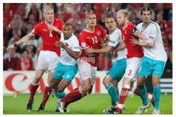 Jostling - Push, elbow, or bump against (someone) roughly, typically in a crowd. (धक्का मुक्की) 