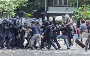 Insurgent - A person who rises in active revolt, typically against an established government or authority. (विद्रोही)