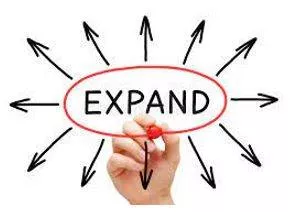 Expanding - To become or to make something bigger. (फैलना या फैलाना) 
