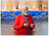 Prime minister narendra modi joins millions for sacred dip at mahakumbh