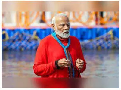 Prime minister narendra modi joins millions for sacred dip at mahakumbh