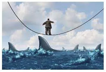 Vulnerable - Exposed to the possibility of being attacked or harmed, either physically or emotionally. (असुरक्षित)