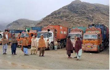 Afghan and pakistani forces trade fire at the border as a key crossing remains closed