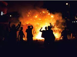 Riot - Noisy, violent, and uncontrolled behaviour by a group of people in a public place, often as a protest.