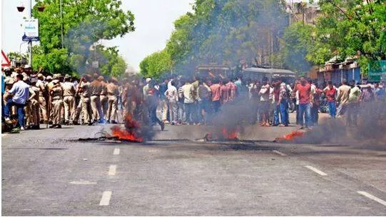 Protest in jaipur over temple vandalism  mob tries to set petrol pump on fire  suspect arrested