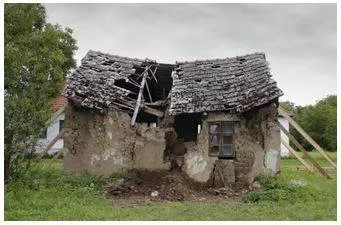 Ruinous - Destroyed or severely damaged, especially to the point of being beyond repair or recovery.
