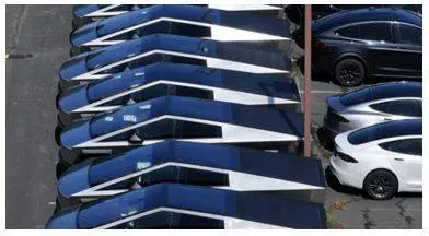 Elon musk's tesla cuts cybertruck production targets  shifts workers due to falling sales  report