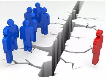 Alienating - To make someone feel that they are different and not part of a group. (अलग-थलग)