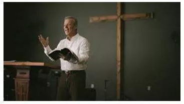 Preaching - The delivery of a sermon or religious address to an assembled group of people, typically in church. (उपदेश) 