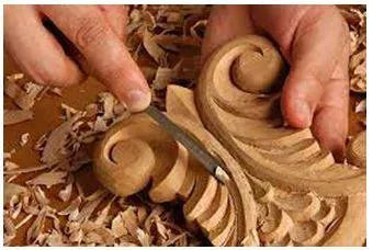 Carving - An object or design carved from a hard material as an artistic work. (नक्काशी)