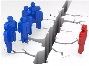 Alienating - To make someone feel that they are different and not part of a group. (अलग-थलग) 