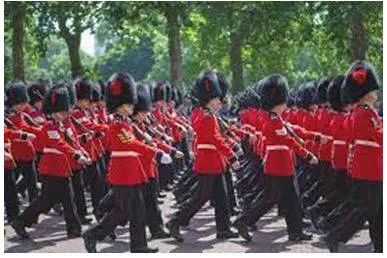 Marched - Walk in a military manner with a regular measured tread. (यातायात)