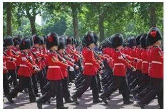 Marched - Walk in a military manner with a regular measured tread. (यातायात)