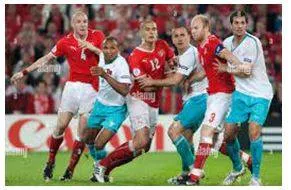 Jostling - Push, elbow, or bump against (someone) roughly, typically in a crowd.