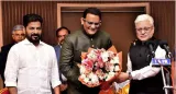 Former cricketer azharuddin sworn in as minister in telangana cabinet