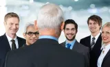 How organisations enshrine collective stupidity and employees are rewarded for checking their brains at the office door