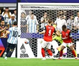 Messi sets record, Argentina in knockouts