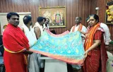 Telangana weaver presents silk saree that fits into a matchbox to A.P. temple