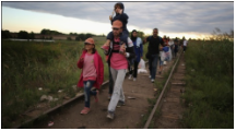 Migrant - A person who moves from one place to another in order to find work or better living conditions.