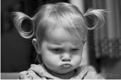 Grumble  - Complain about something in a bad-tempered way.