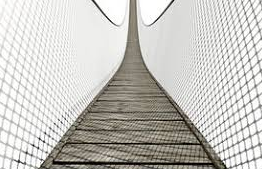 Straddle - (Extend across or be situated on both sides of.)