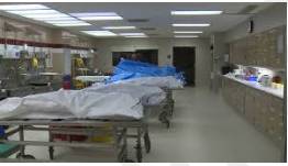 Morgue - (A place where bodies are kept, especially to be identified or claimed.)