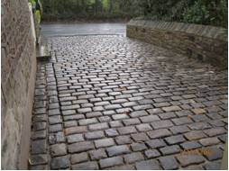 Cobble  - Roughly assemble or produce something from available parts or elements.