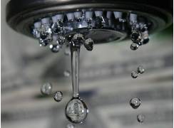 Trickle  - To flow in a broken irregular stream.
