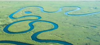 Meandering  - A winding path or course.