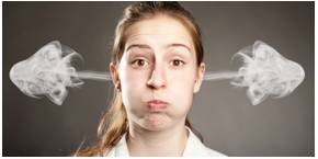 Indignation  - Anger about a situation that you think is wrong or not fair.