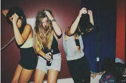 Revel  - Enjoy oneself in a lively and noisy way, especially with drinking and dancing.