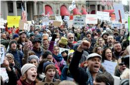 Outcry  - A strong expression of anger and disapproval about something, made by a group of people or by the public: