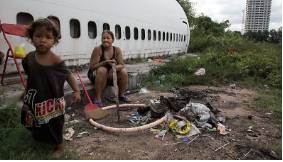 Impoverished  - Lacking money or material possessions.