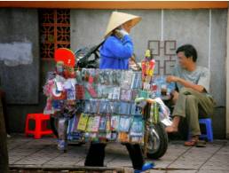 Peddle  - Try to sell (something, especially small goods) by going from place to place.