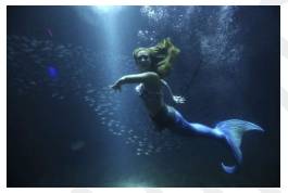 Surreal  - Strange; not seeming real; like a dream.