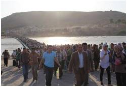 Influx  - Meaning: an arrival or entry of large numbers of people or things.