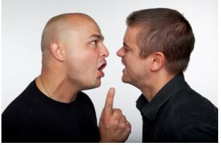 Offensive  - Meaning: actively aggressive; attacking; causing someone to feel resentful, upset, or annoyed.