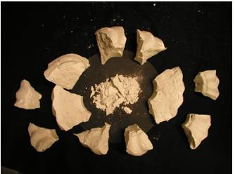 Crumble  - Meaning: break or fall apart into small fragments, especially as part of a process of deterioration.