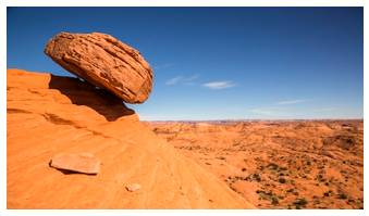 Precarious  - Meaning: not securely held or in position; uncertain