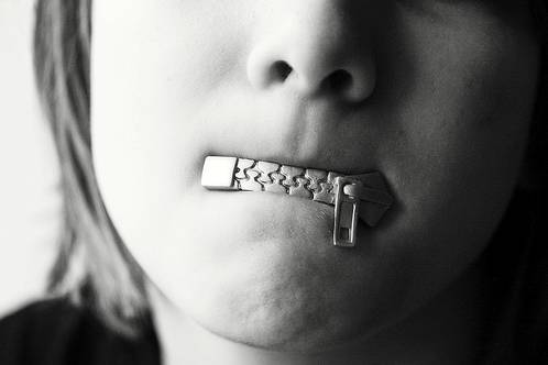 Reticence  - Meaning: An unwillingness to do something or talk about something, for example because you are nervous or being careful.