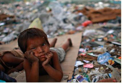 Squalor  - Meaning: The condition of being extremely dirty and unpleasant, often because of lack of money.