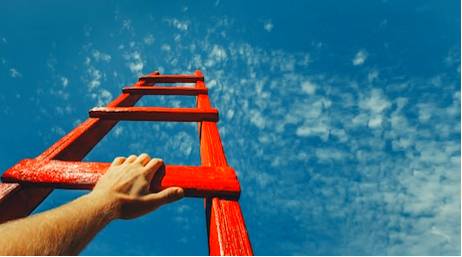 Aspirational  - Meaning: Showing that you want to have more money and a higher social position than you now have.