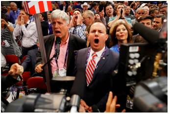 Clamour  - Meaning: A loud and confused noise, especially that of people shouting.