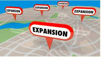 Expansion  - Meaning-  The action of becoming larger or more extensive.