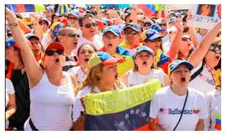 Clamour  - Meaning- A loud and confused noise, especially that of people shouting.