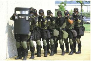 Swoop  - Meaning- (especially of police or soldiers) to visit or attack somebody/something suddenly and without warning.