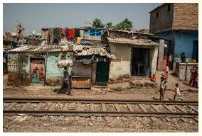 Shanty - Meaning- A small house, built of pieces of wood, metal and cardboard, where very poor people live, especially on the edge of a big city.