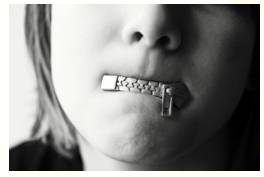 Reticence  - Meaning- A dislike of telling people about things.