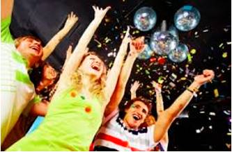 Revel  - Enjoy oneself in a lively and noisy way, especially with drinking and dancing.