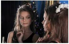 Preen  - (of a person) devote effort to making oneself look attractive and then admire one's appearance.